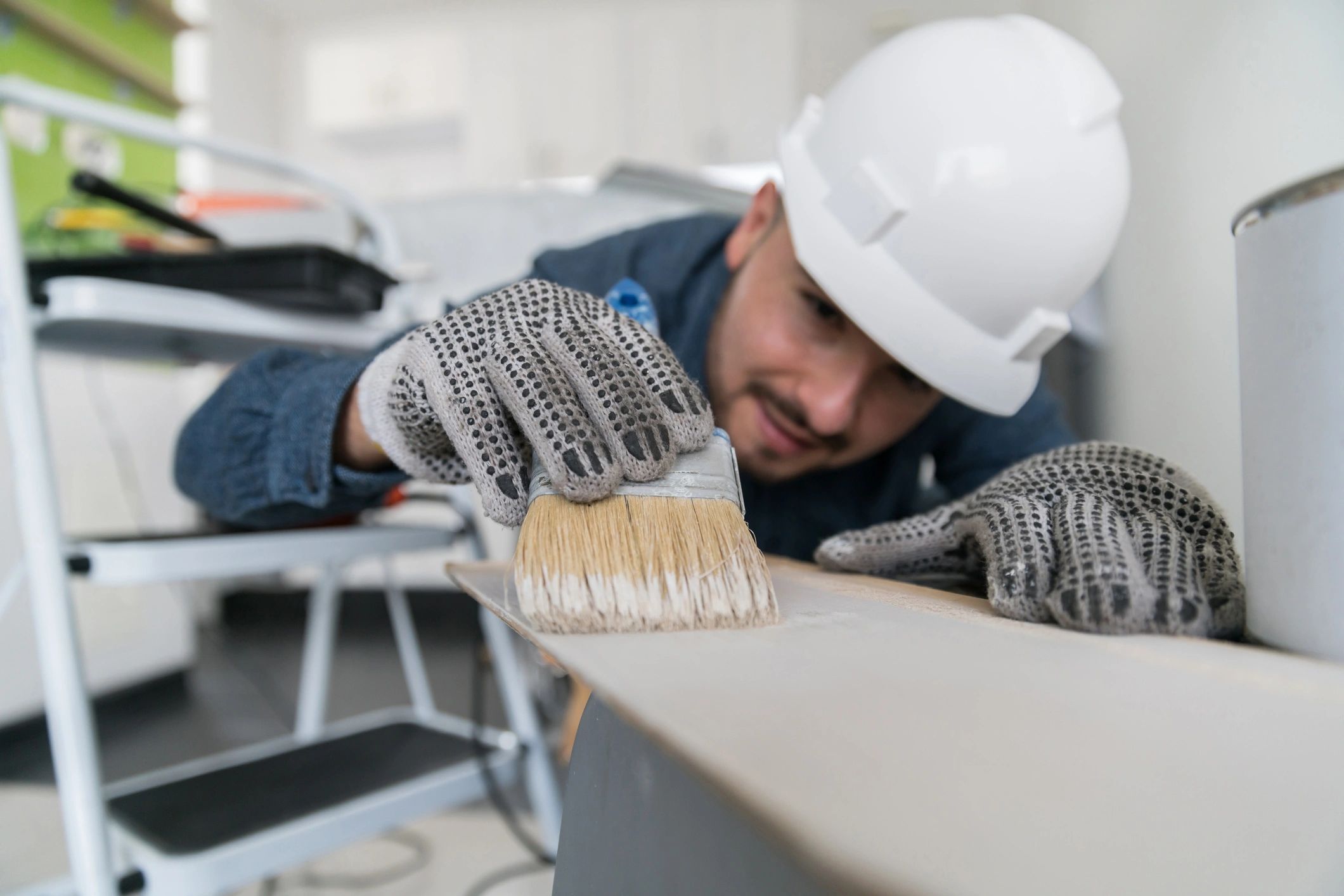Professional contractor painting a commercial property