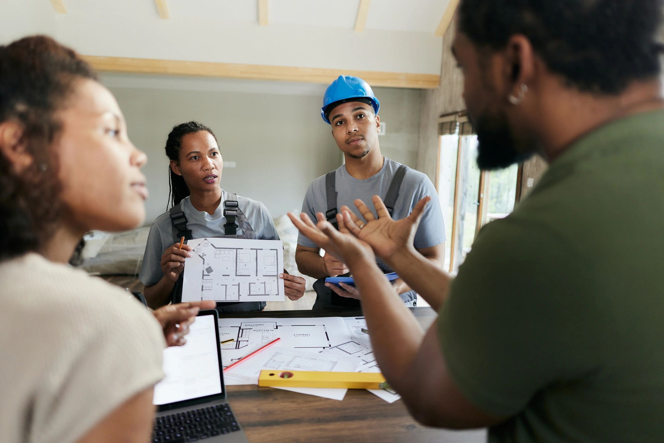 Team meeting discussing property renovation project